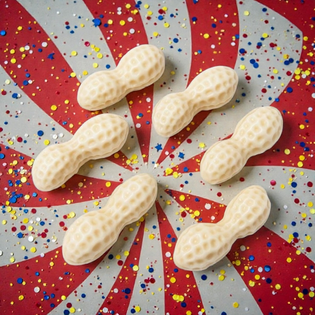 Peanut-shaped wax melts on a Union Jack background with colorful confetti