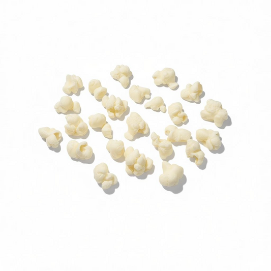 Movie Night Popcorn kernels wax melts scattered on a white background